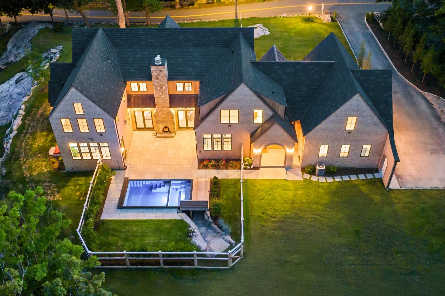 Modern custom home in Massachusetts designed and built by Oak, showcasing craftsmanship and architectural detail.