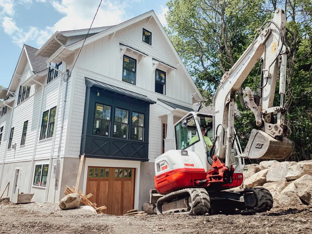A design-build home builder in Massachusetts preparing a site for custom home construction.